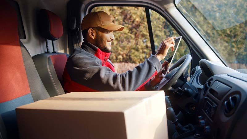 Man driving delivery truck