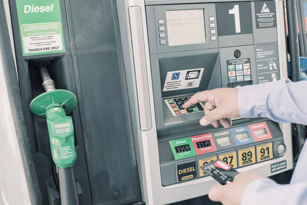 Hand inserting card at pump