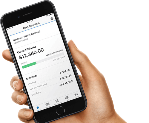 Hand holding mobile phone with Fleet SmartHub app.