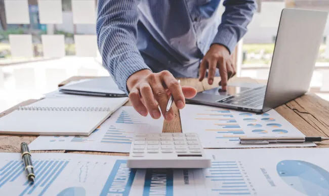 Business administrator analyzing fuel theft prevention and cash flow statistics.