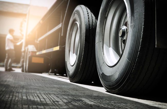 Manager using automated vehicle service reminders to reduce fleet fuel costs.