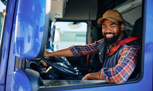 Driver appreciating the convenience and enhanced security of using a fleet fuel card.