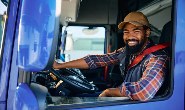Driver appreciating the convenience and enhanced security of using a fleet fuel card.