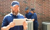 An HVAC owner is able to view fuel card account data on his tablet on site at an air conditioner install.