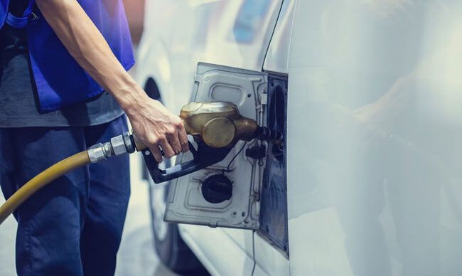 Image 2 alt text An HVAC driver fuels his van with a fleet card.