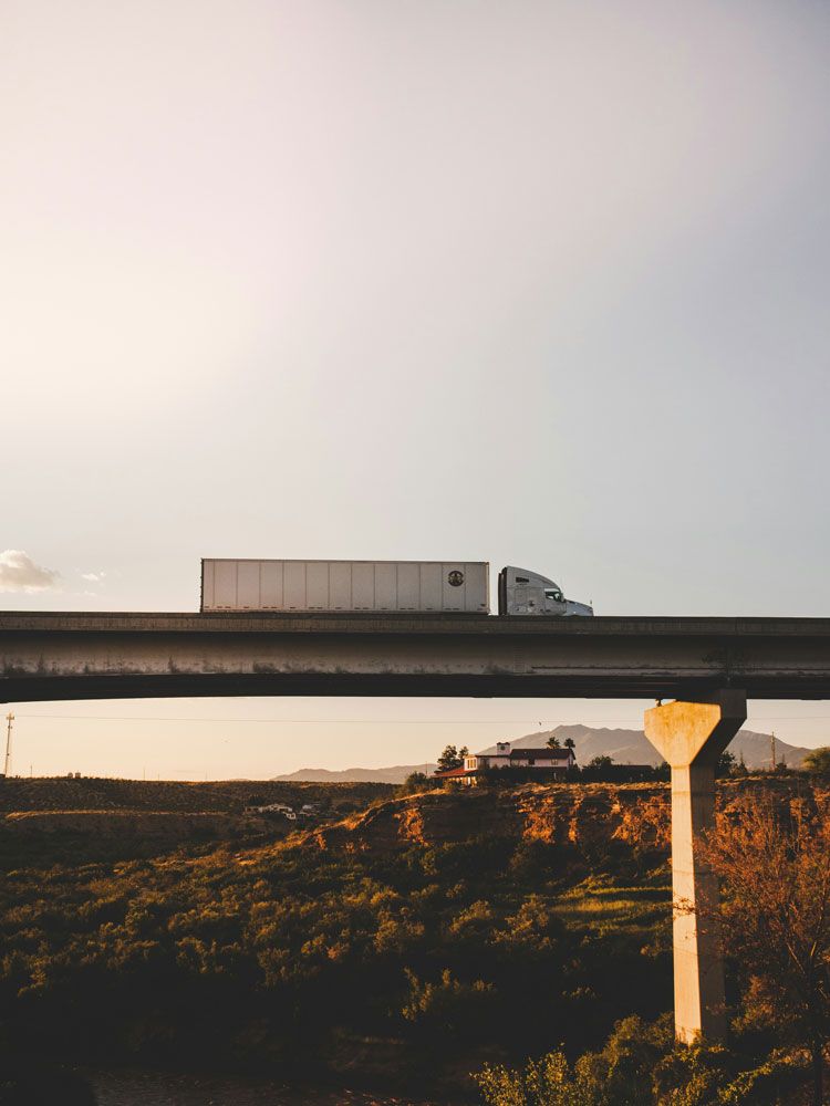 View of a semi truck on its route.