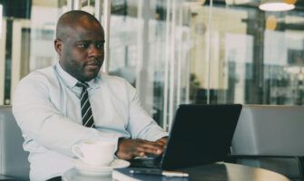A manufacturing owner reviews fuel card usage in real-time from his laptop.
