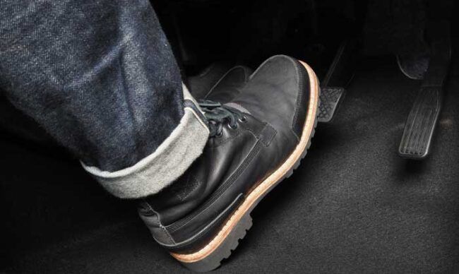 A truck driver’s boot as it presses the brake.