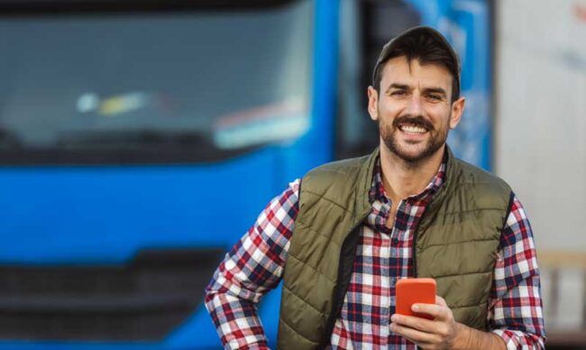 A fleet owner gets real-time alerts on his cell phone about purchases made by his fleet drivers.